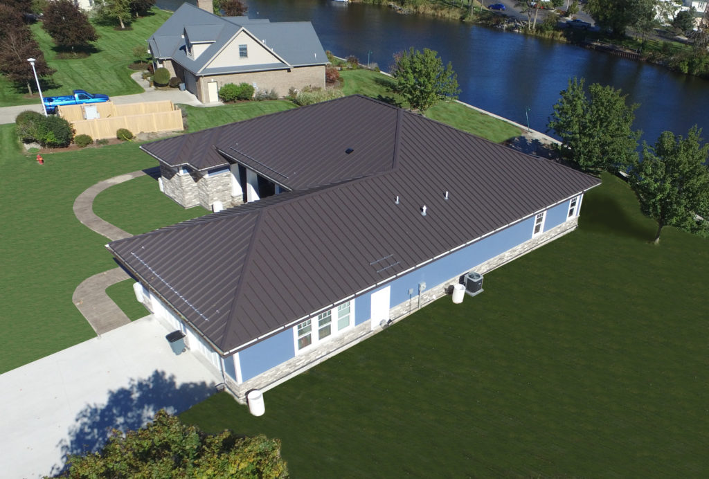 Metal roof building with clear snow guards